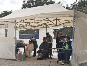 barbering in a tent